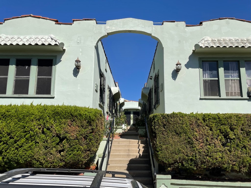 Close-up of entryway to the apartment building where Ida Sessions was murdered in Chinatown film to show narrow path to her apartment